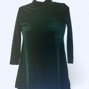 Green velvet mock neck dress with 3/4 sleeves. 7 New Moves